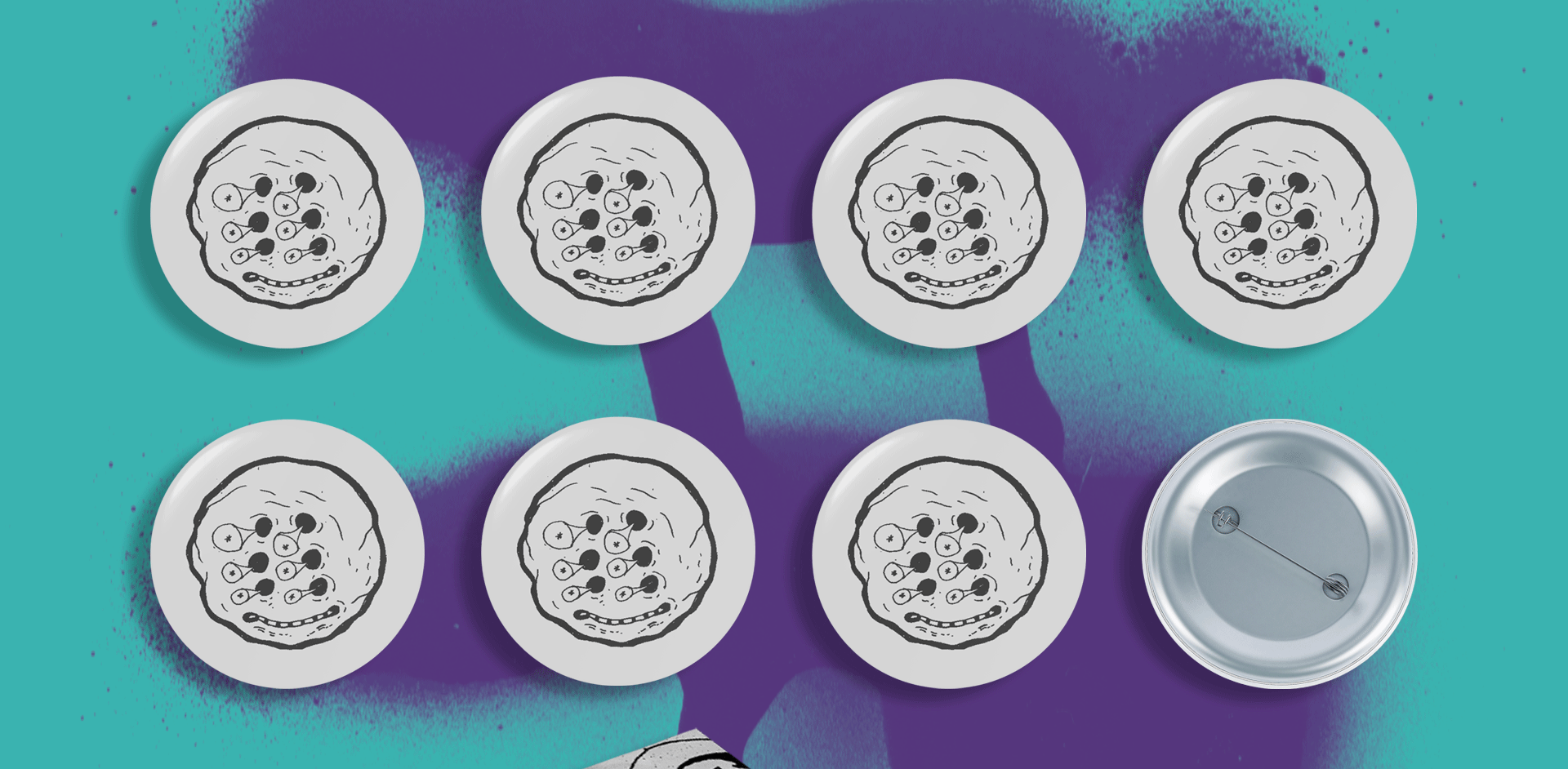 Seven round buttons with a black and white cookie cartoon face design are arranged in two rows on a teal background, showcasing a playful mockup. An eighth button is flipped over, revealing the pin side. A purple abstract splash adds an artistic touch to this graphic design scene.